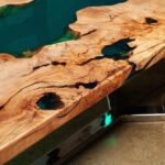 Close-up view of the epoxy resin detail on the Sylva Home custom arc edge epoxy river dining table, model ET42.