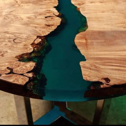 Side view of the Sylva Home custom arc edge epoxy river dining table, model ET42, showcasing the table's edge and legs.