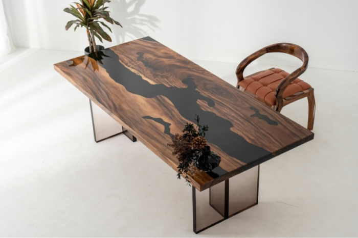 Full view of the Sylva Home custom black river walnut epoxy table, model ET33, highlighting its design and finish.