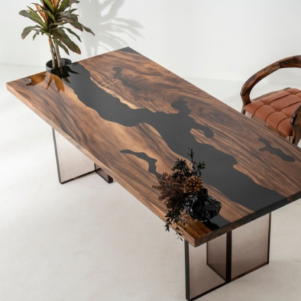 Side view of the Sylva Home custom black river walnut epoxy table, model ET33, showcasing the table's edge and legs.