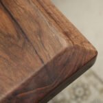 Close-up of the surface finish on the Sylva Home custom black walnut dining epoxy resin river table, model ET9.