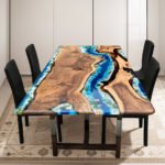 Top view of the Sylva Home custom black walnut epoxy ocean dining table, model ET38.