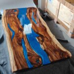 Full view of the Sylva Home custom black walnut epoxy resin river table, model ET2, highlighting its design and finish.