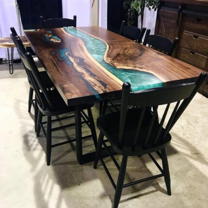 Angled view of the Sylva Home custom black walnut epoxy resin table, model ET7, showing the table’s depth and texture.