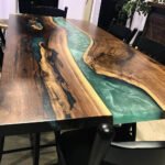 Side view of the Sylva Home custom black walnut epoxy resin table, model ET7, showcasing the table’s edge and design.