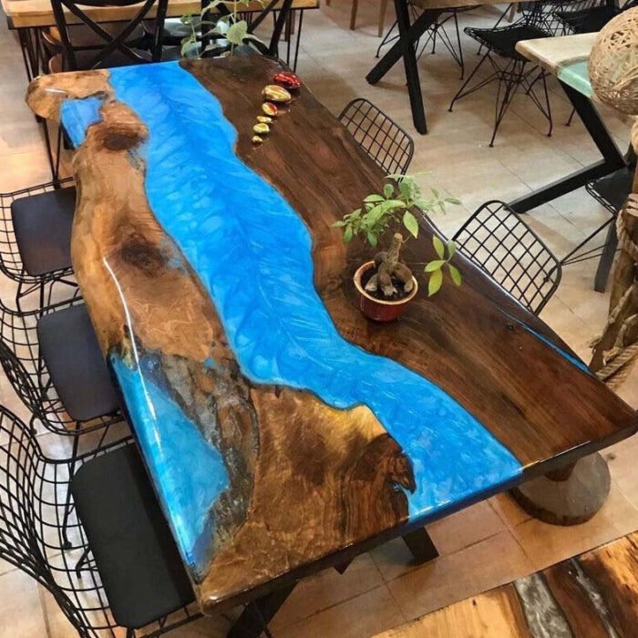 Top view of the Sylva Home custom black walnut epoxy river dining table tops, model ET28.