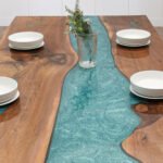 View of the river pattern created by the epoxy resin on the Sylva Home custom black walnut epoxy river table, model ET51.