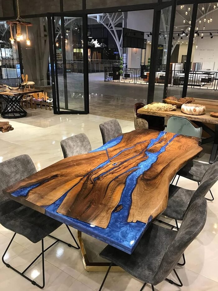 Close-up view of the epoxy resin detail on the Sylva Home custom black walnut live edge blue epoxy river table, model ET50.