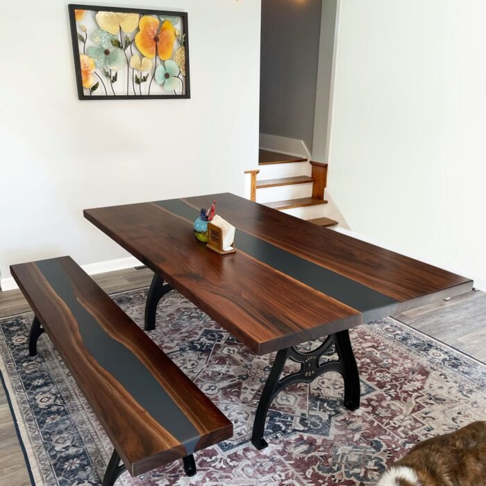 Close-up view of the epoxy resin detail on the Sylva Home custom black walnut slab epoxy river table, model ET36.