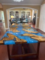 Full view of the Sylva Home custom Cunninghamia wood epoxy dining table, model ET53, highlighting its design and finish.