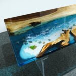 View of the ocean wave pattern created by the epoxy resin on the Sylva Home custom epoxy resin ocean table, model ET55.