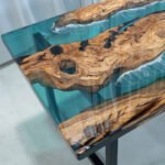 Close-up view of the epoxy resin detail on the Sylva Home custom epoxy resin river dining table, model ET47.