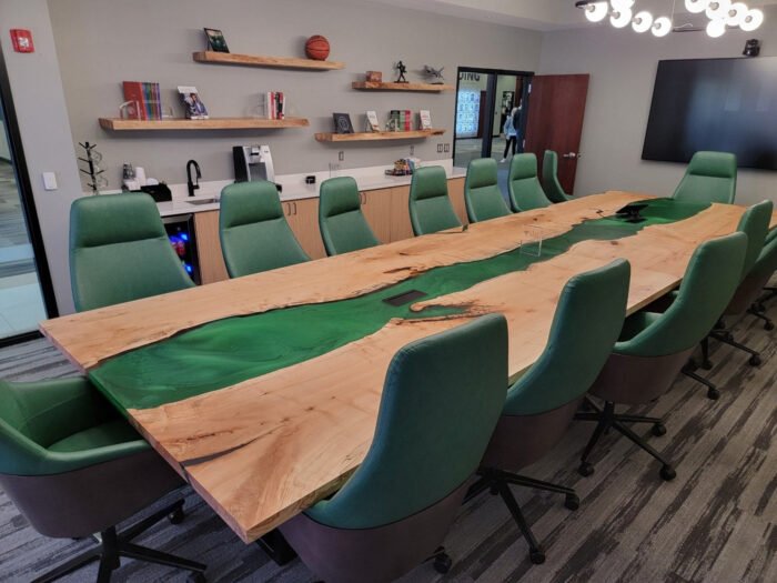 Angled view of the Sylva Home custom green epoxy resin river conference table, model ET12, showing the table’s depth and texture.