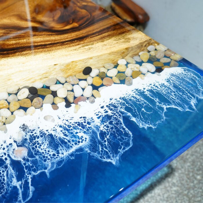 View of the ocean wave pattern created by the epoxy resin on the Sylva Home custom ocean wave walnut epoxy dining table, model ET24.