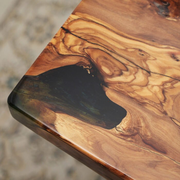 Close-up of the table surface finish on the Sylva Home custom olive green wave epoxy table, model ET5.