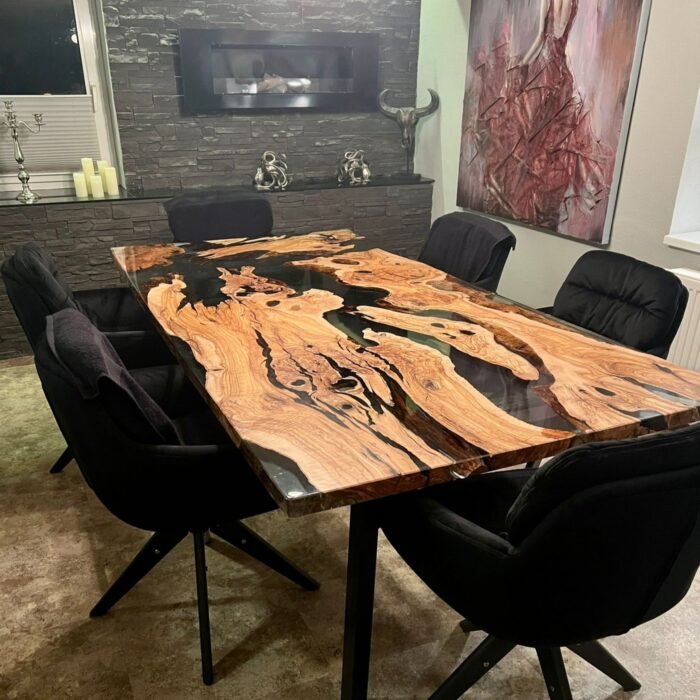 Side view of the Sylva Home custom olive live edge dining table with epoxy, model ET44, showcasing the table's edge and legs.