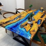 Top view of the Sylva Home custom olive wood epoxy ocean wave dining table, model ET45.