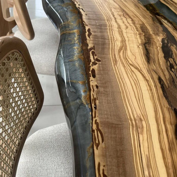 Perspective view of the Sylva Home custom olive wood epoxy river dining table, model ET40, highlighting its size and presence in a dining room setting.