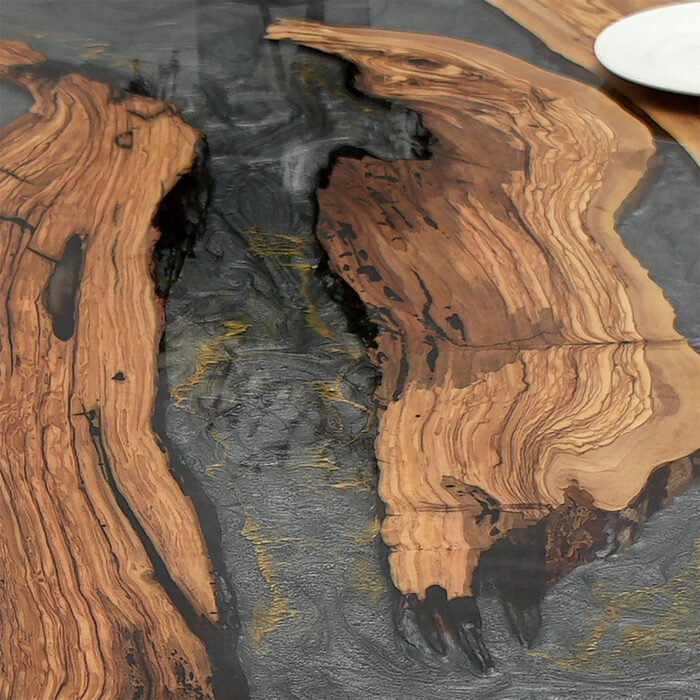 Close-up of the table surface finish on the Sylva Home custom olive wood epoxy river dining table, model ET40.