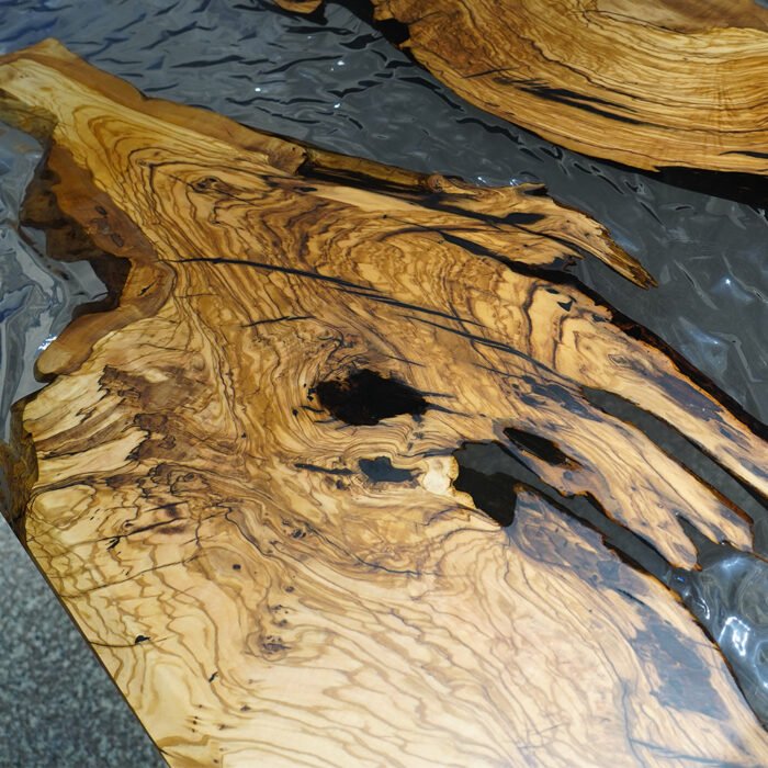 Close-up view of the epoxy resin detail on the Sylva Home custom olive wood ice cracks epoxy resin table, model ET22.