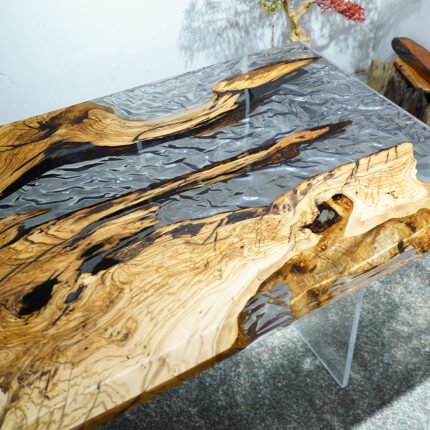 Side view of the Sylva Home custom olive wood ice cracks epoxy resin table, model ET22, showcasing the table's edge and legs.