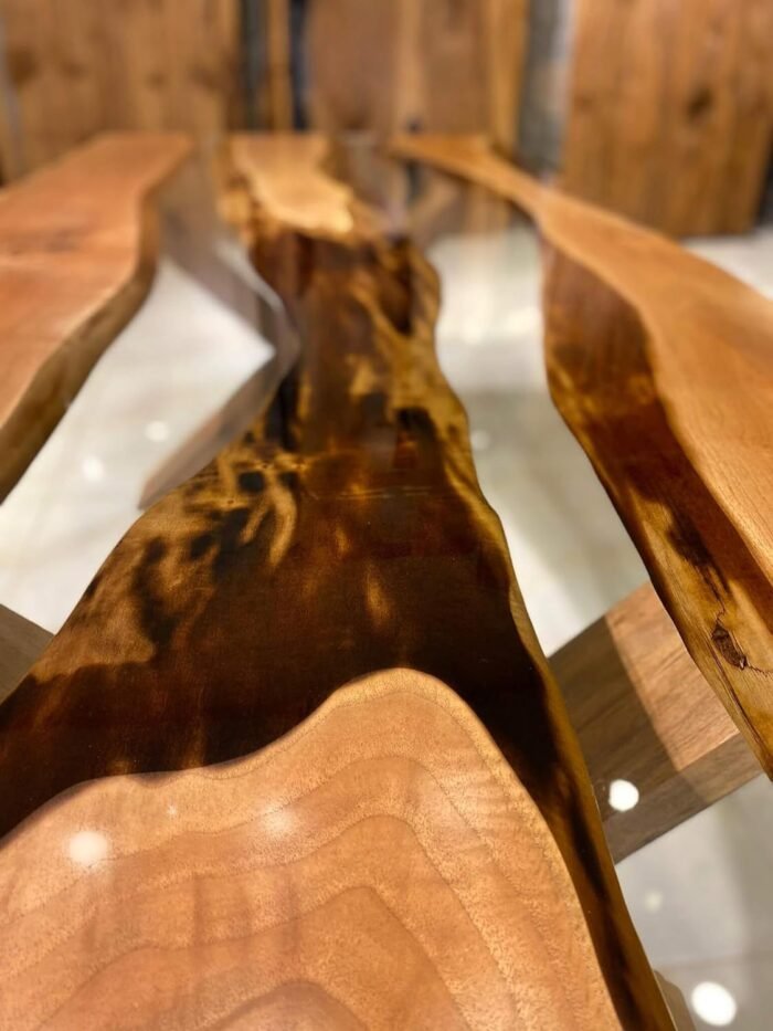 Close-up view of the epoxy resin detail on the Sylva Home custom walnut epoxy live edge table, model ET34.