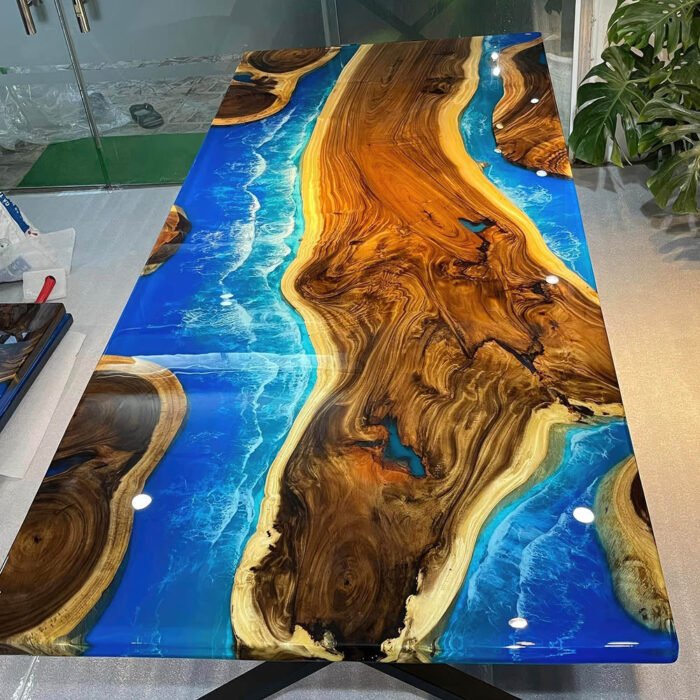 Full view of the Sylva Home custom walnut epoxy ocean table, model ET37, highlighting its design and finish.