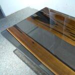 Close-up of the table surface finish on the Sylva Home custom walnut epoxy resin live edge dining table, model ET23.