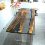 Top view of the Sylva Home custom walnut epoxy resin live edge dining table, model ET23.