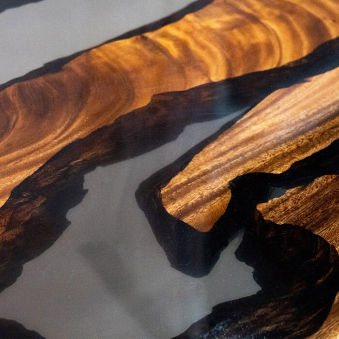 Detailed view of the river pattern created by the epoxy resin on the Sylva Home custom walnut table, model ET1.