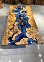 Angled view of the Sylva Home custom walnut epoxy resin river table, model ET20, showing the depth and texture of the table.