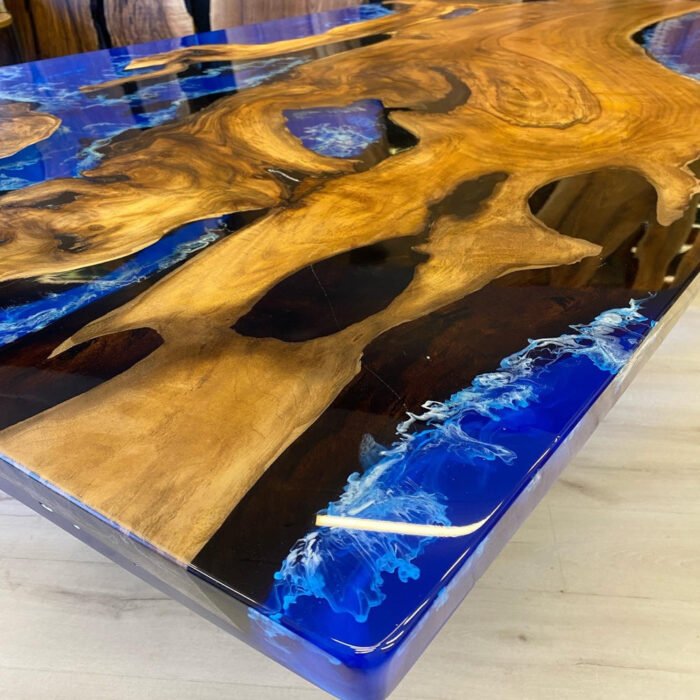 Full view of the Sylva Home custom walnut ocean epoxy resin dining table, model ET54, highlighting its design and finish.