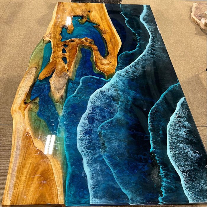 View of the ocean wave pattern created by the epoxy resin on the Sylva Home custom walnut wood ocean wave epoxy dining table, model ET30.