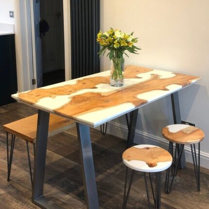 Side view of the Sylva Home custom white epoxy resin river dining table, model ET31, showcasing the table's edge and legs.