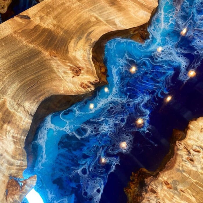 Close-up view of the epoxy resin detail on the Sylva Home custom epoxy blue river waterfall table, model ET62.