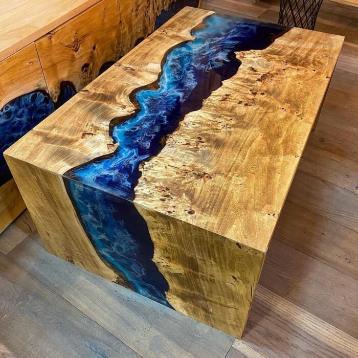 Full view of the Sylva Home custom epoxy blue river waterfall table, model ET62, highlighting its design and finish.