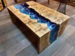 Close-up of the table surface finish on the Sylva Home custom epoxy blue river waterfall table, model ET62.