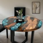 Full view of the Sylva Home custom epoxy round river coffee table, model ET70, highlighting its design and finish.