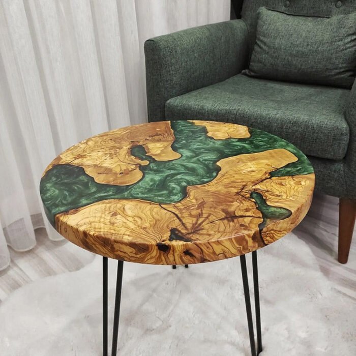 Side view of the Sylva Home custom resin round coffee table, model ET71, showcasing the table's edge and legs.