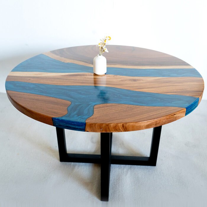 Detailed view of the table leg design on the Sylva Home custom round epoxy coffee table, model ET69.