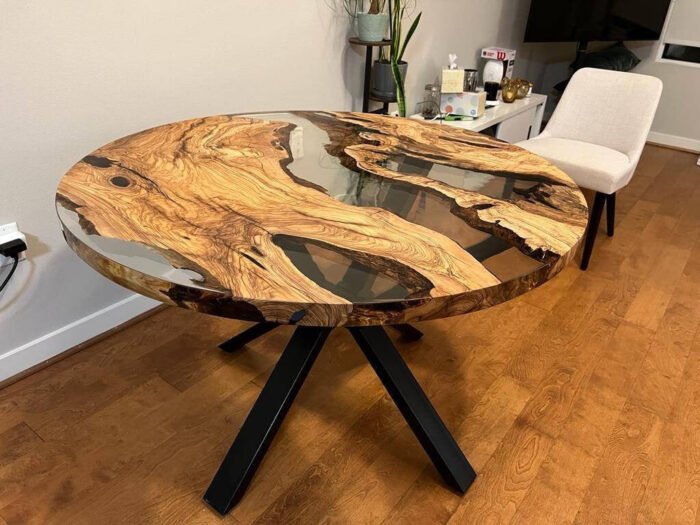 Full view of the Sylva Home custom round epoxy river coffee table, model ET76, highlighting its design and finish.