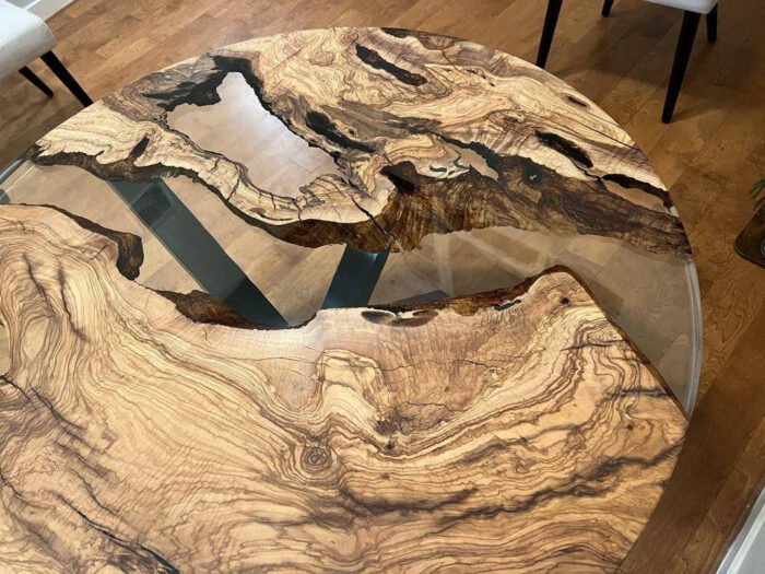 View of the epoxy resin pattern on the Sylva Home custom round epoxy river coffee table, model ET76.