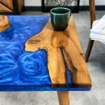 Side view of the Sylva Home custom walnut square epoxy resin coffee table, model ET59, showcasing the table's edge and legs.